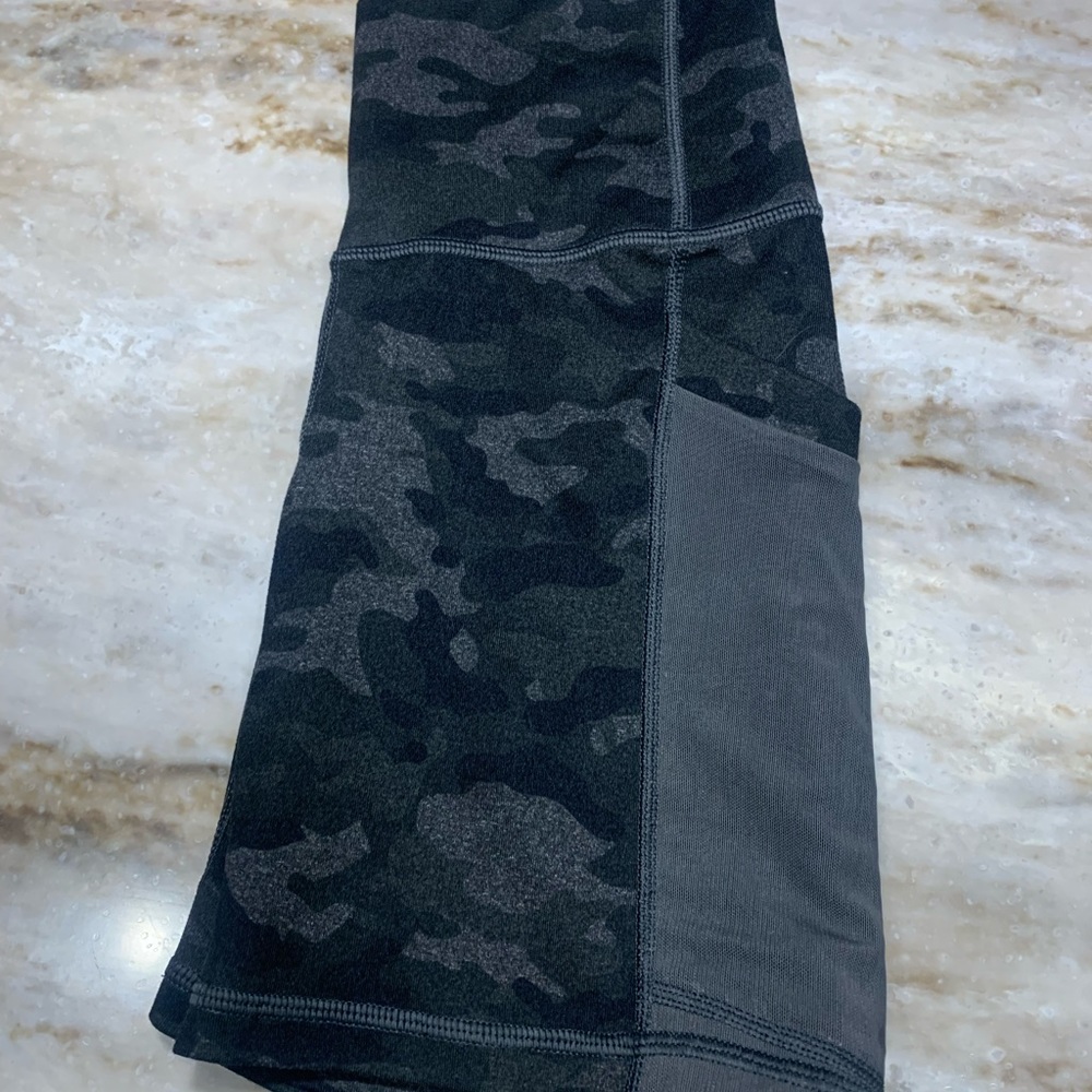 Black and gray Fabletics biker shorts, size small